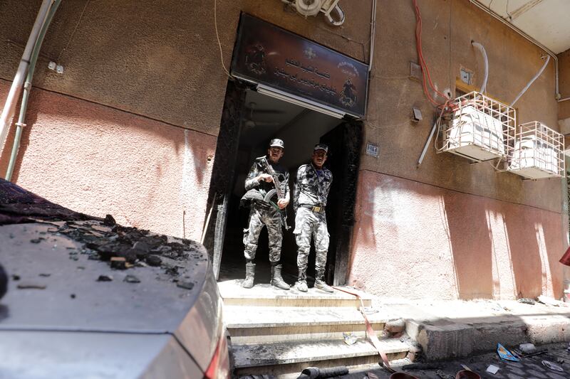 Security forces members at the scene of the tragedy. Reuters