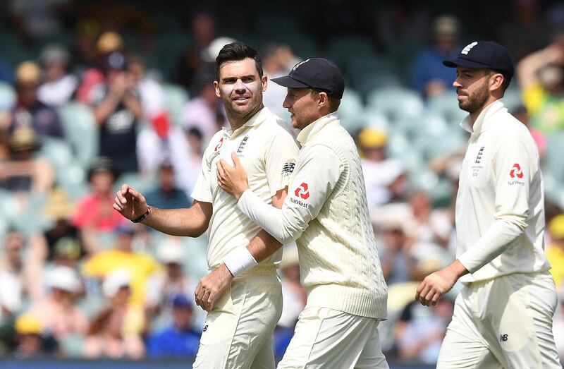 England bowler James Anderson, left celebrates dismissing Mitchell Starc to claim his fifth wicket of the innings. Dave Hunt / EPA