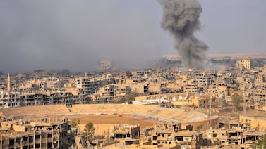 Smoke rises the eastern city of Deir Ezzor as Syrian government forces fight against ISIS, in 2017. AFP