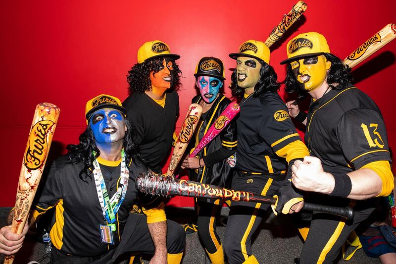 Attendees dressed as the Baseball Furies from 'The Warriors' pose during New York Comic Con. AP