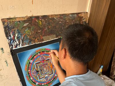 An artist using the traditional thangka painting process. Photo: Sakshi Agrawal 