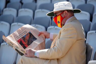 Cricket - First Test - England v New Zealand - Lord's Cricket Ground, London, Britain - June 2, 2021 A MCC member reads a newspaper in the stand before play Action Images via Reuters/Andrew Couldridge