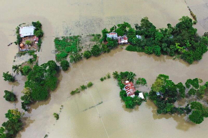 The submerged Bangladeshi houses after the flooding in Sunamganj. Almost four million people have been hit by monsoon floods in South Asia, with a third of Bangladesh already under water from some of the heaviest rains in a decade. AFP