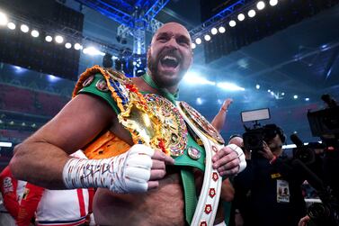 Britain’s Tyson Fury celebrates after beating Britain’s Dillian Whyte to win their WBC heavyweight title boxing fight at Wembley Stadium in London, Saturday, April 23, 2022.  (Nick Potts / PA via AP)