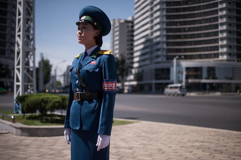 The face of Pyongyang: a traffic lady takes control of her junction.  Ed Jones / AFP