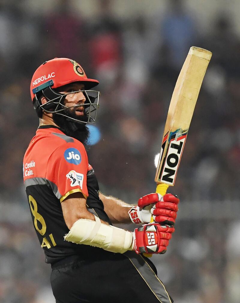 Royal Challengers Bangalore's cricketer Moeen Ali plays a shot during the 2019 Indian Premier League (IPL) Twenty 20 cricket match between Kolkata Knight Riders and Royal Challengers Bangalore at the Eden Gardens Cricket Stadium, in Kolkata on April 19, 2019. (Photo by DIBYANGSHU SARKAR / AFP) / ----IMAGE RESTRICTED TO EDITORIAL USE - STRICTLY NO COMMERCIAL USE-----