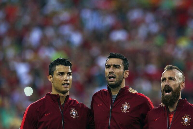 Portugal players Cristiano Ronaldo, left, Rui Patricio, centre, and Raul Meireles, right, during the national anthems before the start of Tuesday's international friendly against Ireland. Jose Sena Goulao / EPA / June 10, 2014