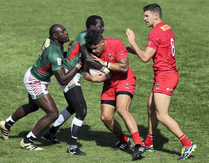 Dubai, United Arab Emirates - December 1st, 2017: Mike Fuailefau of Canada is tackled during the game between Canada and Kenya at the 2nd Day of Dubai Rugby 7's. Friday, December 1st, 2017 at The Sevens, Dubai. Chris Whiteoak / The National