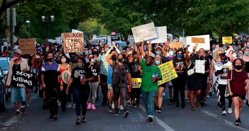 Hundreds of protesters march to St. Louis Mayor Lyda Krewson's home on Sunday. St. Louis Post-Dispatch via AP