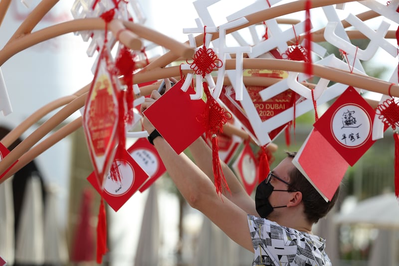 Residents decorate the China pavilion for Chinese New Year celebrations at Expo 2020 Dubai. Chris Whiteoak / The National