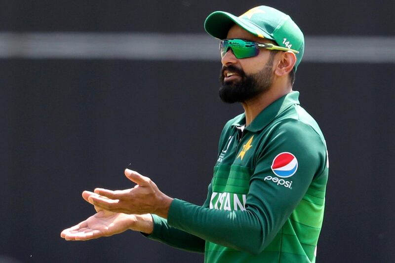 FILE - In this June 29, 2019, file photo, Pakistan's Mohammad Hafeez fields during the Cricket World Cup match between Pakistan and Afghanistan at Headingley in Leeds, England. Pakistan allrounder Mohammad Hafeez regards the home series against Bangladesh next week as an audition for the Twenty20 World Cup squad before he exits international cricket. (AP Photo/Rui Vieira, File)