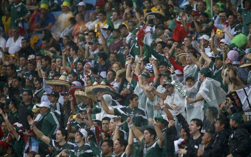 Mexico fans celebrate after Oribe Peralta's goal on Friday in the 1-0 victory over Cameroon at the 2014 World Cup in Brazil. Jorge Silva / Reuters