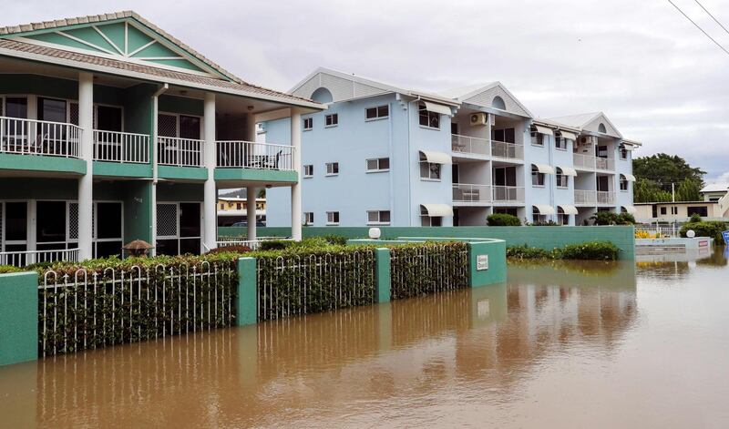 Apartment blocks sit in floodwaters. AFP