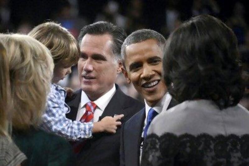 President Barack Obama and Republican presidential nominee Mitt Romney greet family members following the final US presidential debate in Boca Raton, Florida.
