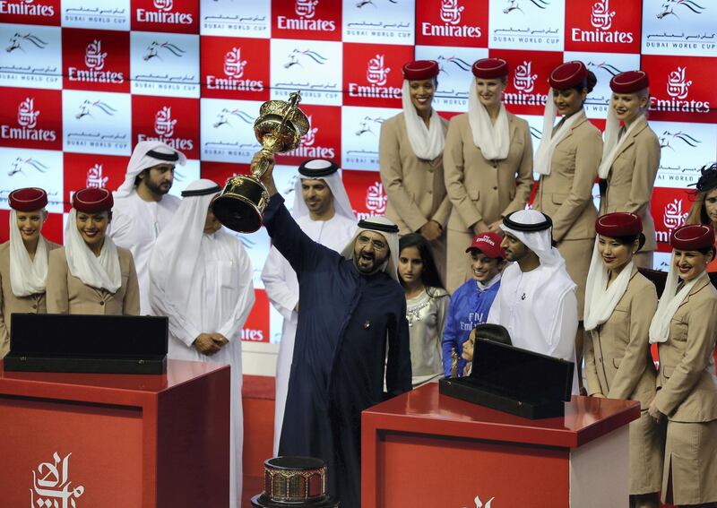 DUBAI, UNITED ARAB EMIRATES - MARCH 29:  Sheikh Mohammed bin Rashid Al Maktoum, Ruler of Dubai and Vice President of the UAE rejoices after winning the Dubai World Cup with his horse African Story ridden by Silvestre De Sousa during the Dubai World Cup  at the Meydan Racecourse on March 29, 2014 in Dubai, United Arab Emirates.  (Photo by Francois Nel/Getty Images)