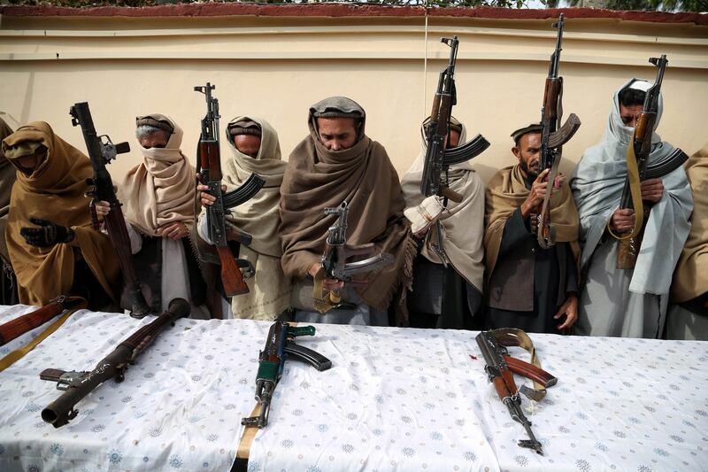 epa07269252 Former Taliban and IS militants surrender their weapons during a reconciliation ceremony in Jalalabad, Afghanistan, 08 January 2019. A group of 16 former Taliban and eight IS militants on 08 January, laid down their arms in Jalalabad and joined the peace process. Under an amnesty launched by former President Hamid Karzai and backed by the US in November 2004, hundreds of anti-government militants have surrendered to the government.  EPA/GHULAMULLAH HABIBI