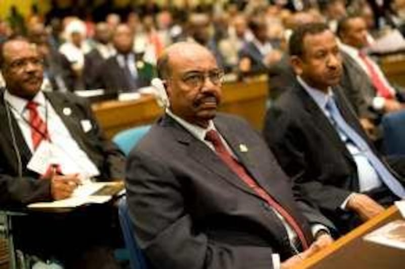 Sudan's President Omar al-Bashir, center, takes part in the 14th Ordinary Session of the Assembly of the African Union at UN Conference Hall in Addis Ababa, Ethiopia, Sunday, Jan. 31, 2010. (AP Photo/Jon Black)   *** Local Caption ***  XSA105_Ethiopia_AU_Summit.jpg