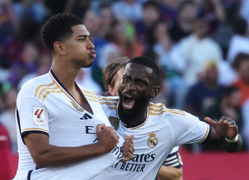 Real Madrid's Jude Bellingham celebrates scoring their first goal with Antonio Rudiger in the 2-1 Clasico win against Barcelona at the Estadi Olimpic Lluis Companys on October 28, 2023. Reuters