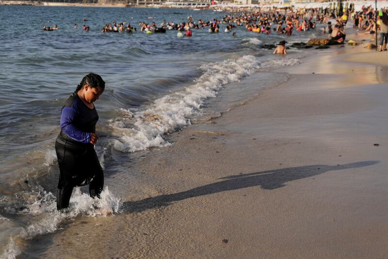 A girl at Alexandria's public beach for people with disabilities.