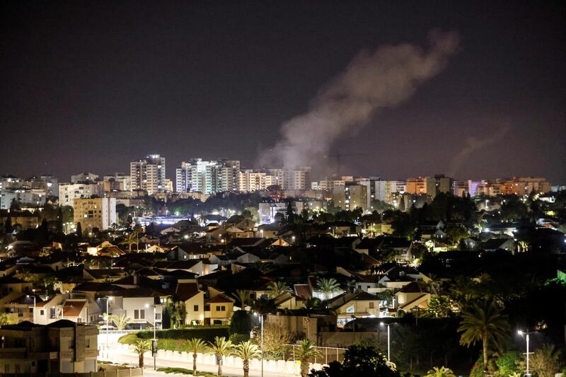 Smoke rises over houses in Ashkelon, in southern Israel, after a rocket attack launched from Gaza. Reuters / Amir Cohen