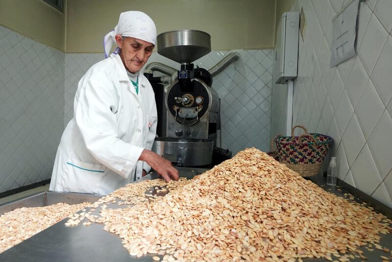 An Amazigh woman works on argan kernels at Women's Agricultural Cooperative Taitmatine, in Tiout, near Taroudant, Morocco June 10, 2021. Picture taken June 10, 2021. REUTERS/Abdelhak Balhaki