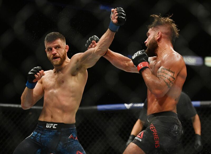 May 9, 2020; Jacksonville, Florida, USA; Jeremy Stephens (red gloves) fights Calvin Kattar (blue gloves) during UFC 249 at VyStar Veterans Memorial Arena. Mandatory Credit: Jasen Vinlove-USA TODAY Sports