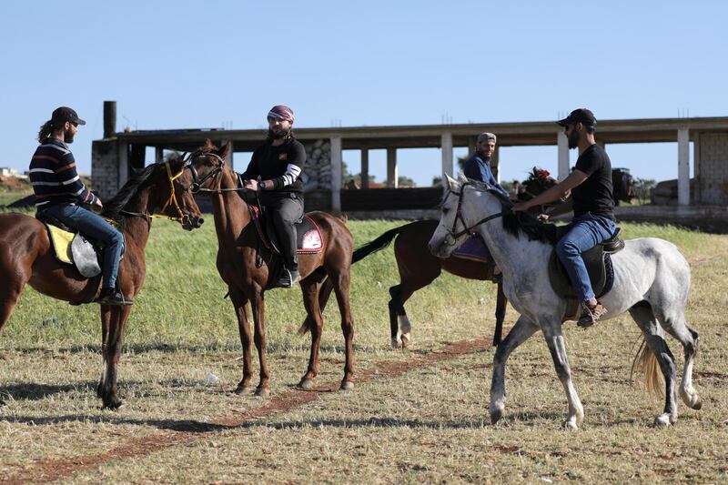 Horseriders at Zaim farm, a riding school and a sanctuary for horses, in Idlib, Syria. Reuters