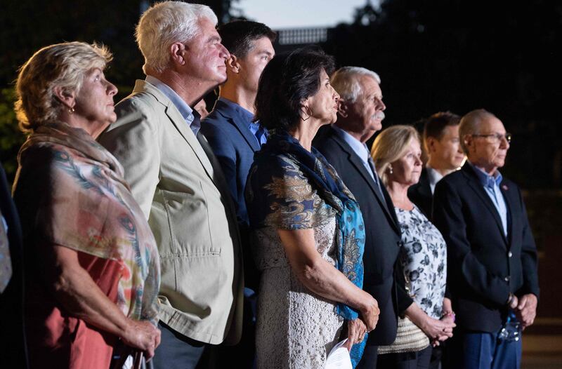 Diane Foley (centre) stands alongside Carl Mueller and Marsha Mueller as well as other family members of two other killed ISIS hostages. AFP