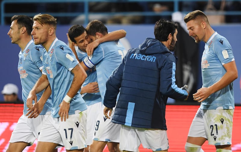 Lazio's Senad Lulic celebrates scoring their second goal with teammates. Lazio won the match 3-1. Reuters
