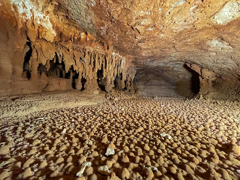 Mounds known as stalagmites on the floor of a cave.