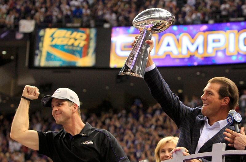 Baltimore Ravens head coach John Harbaugh (L) celebrates as team owner Steve Bisciotti holds up the Vince Lombardi Trophy after defeating the San Francisco 49ers in the NFL Super Bowl XLVII football game in New Orleans, Louisiana, February 3, 2013. REUTERS/Sean Gardner (UNITED STATES  - Tags: SPORT FOOTBALL)   *** Local Caption ***  NEO818_NFL-SUPERBOW_0204_11.JPG