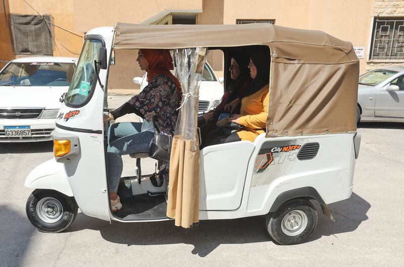 Ms Al-Yamam says she sold her gold to buy the tuk-tuk, which helps her to provide for her family.