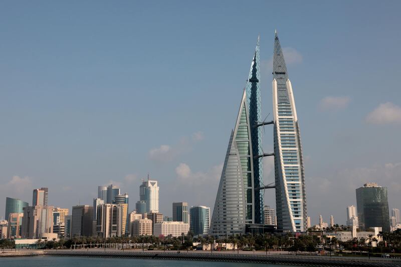 A picture taken on December 3, 2020, shows the world trade centre (R) and the skyline of the Bahraini capital Manama. (Photo by GIUSEPPE CACACE / AFP)