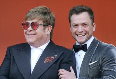 FILE PHOTO: 72nd Cannes Film Festival - Screening of the film "Rocketman" out of competition - Red Carpet Arrivals - Cannes, France, May 16, 2019. Elton John poses with Taron Egerton. REUTERS/Stephane Mahe/File Photo