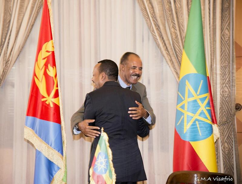 Ethiopia's Prime Minister Abiy Ahmed and Eritrean President Isaias Afwerk embrace at the declaration signing in Asmara, Eritrea July 9, 2018 in this photo obtained from social media on July 10, 2018. GHIDEON MUSA ARON VISAFRIC/via REUTERS THIS IMAGE HAS BEEN SUPPLIED BY A THIRD PARTY. NO RESALES. NO ARCHIVES. MANDATORY CREDIT.     TPX IMAGES OF THE DAY