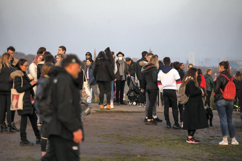 LONDON, ENGLAND - NOVEMBER 07: People gather at the top of at Parliament Hill viewpoint in Hampstead Heath on November 7, 2020 in London, England. The country has gone into it's second national lockdown since the Coronavirus (COVID-19) pandemic began. ((Photo by Hollie Adams/Getty Images)