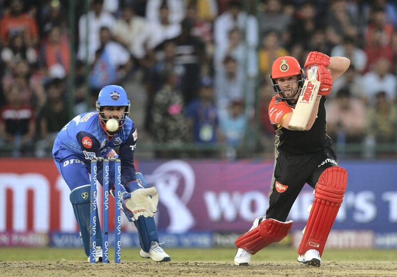 Royal Challengers Bangalore cricketer AB de Villiers plays a shot during the 2019 Indian Premier League (IPL) Twenty20 cricket match between Delhi Capitals and Royal Challengers Bangalore at the Feroz Shah Kotla cricket stadium in New Delhi on April 28, 2019. (Photo by Sajjad HUSSAIN / AFP) / ----IMAGE RESTRICTED TO EDITORIAL USE - STRICTLY NO COMMERCIAL USE-----