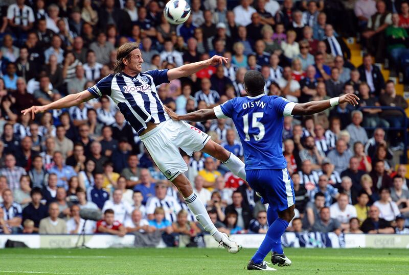 West Bromwich Albion's Swedish defender Jonas Olsson (L) vies with Everton's French defender Sylvain Distin (R) during the English Premier League football match between West Bromwich Albion and Everton at The Hawthorns in West Bromwich, West Midlands, England on September 1, 2012. AFP PHOTO/PAUL ELLIS

RESTRICTED TO EDITORIAL USE. No use with unauthorized audio, video, data, fixture lists, club/league logos or “live” services. Online in-match use limited to 45 images, no video emulation. No use in betting, games or single club/league/player publications.
 *** Local Caption ***  358398-01-08.jpg