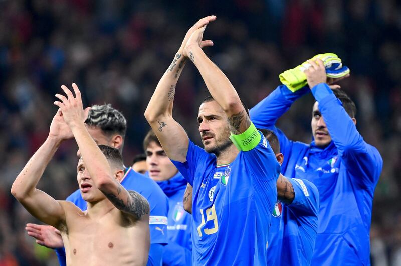 Italian players celebrate their 2-0 victory. AP