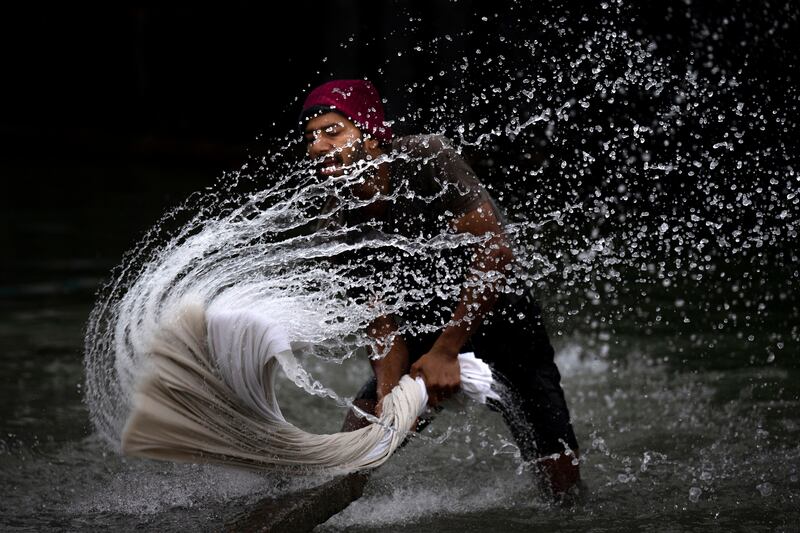 A man washes clothes on the banks of the river Brahmaputra on World Water Day (March 22) in Guwahati, India.  AP Photo