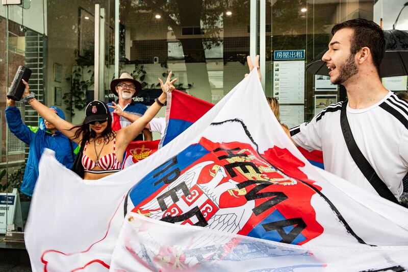 Supporters gather outside Park Hotel calling for Novak Djokovic to be released after the world No 1 was denied entry to Australia as border authorities cancelled his visa. Getty Images