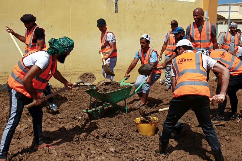 Workers used lorries, shovels and dredging machines to clear debris.