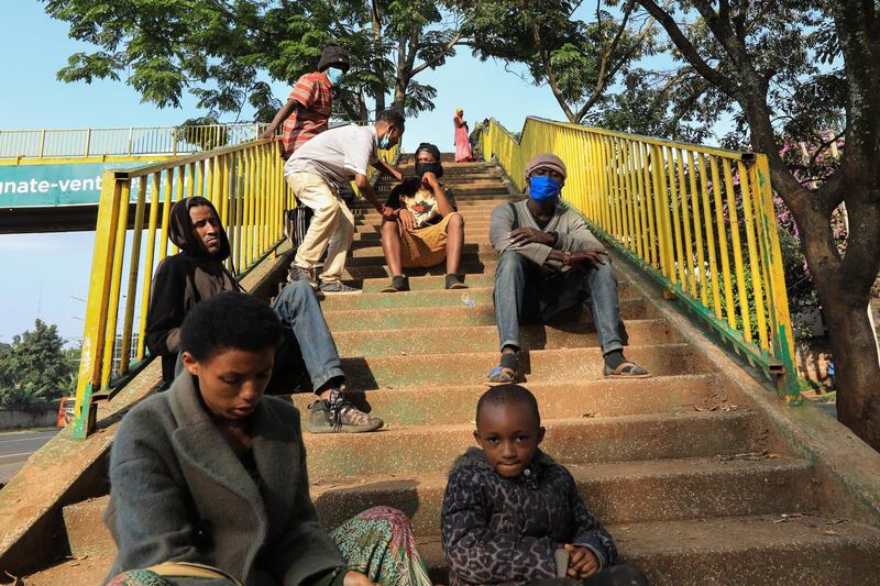 Refugees from different East African countries sit on the staircases of a footbridge where they sleep, ahead of World Refugee Day in Nairobi, Kenya. World Refugee Day is marked annually on 20 June to raise awareness of the situation of refugees around the world. According to the UNHCR, more and more refugees today live in urban settings outside refugee camps. Some crises have lasted so long that the tent camps became built-up urban areas. EPA
