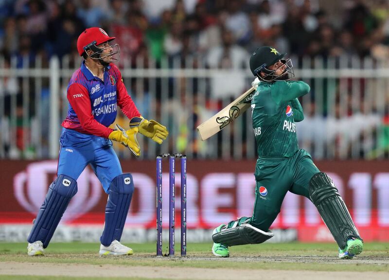 Pakistan's Shadab Khan hits a six.