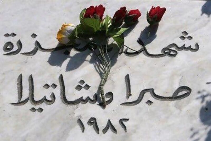 Roses decorate the Palestinian Martyr's Cemetery at Shatila refugee camp in Beirut, during a ceremony to mark the 28th anniversary of the Sabra and Shatila massacre in 1982.  The Arabic words read "The martyrs of Sabra and Shatila massacre, 1982".