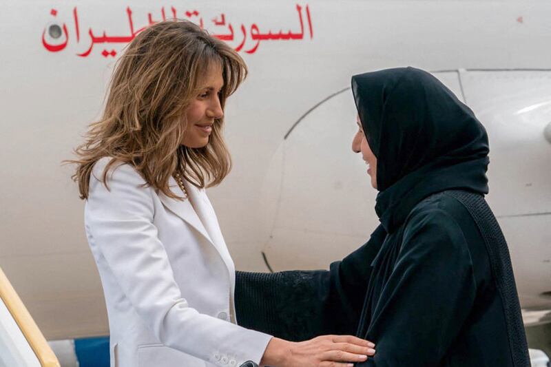 Maitha Al Shamsi, Minister of State, greets Syria's first lady Asma Al Assad. AFP