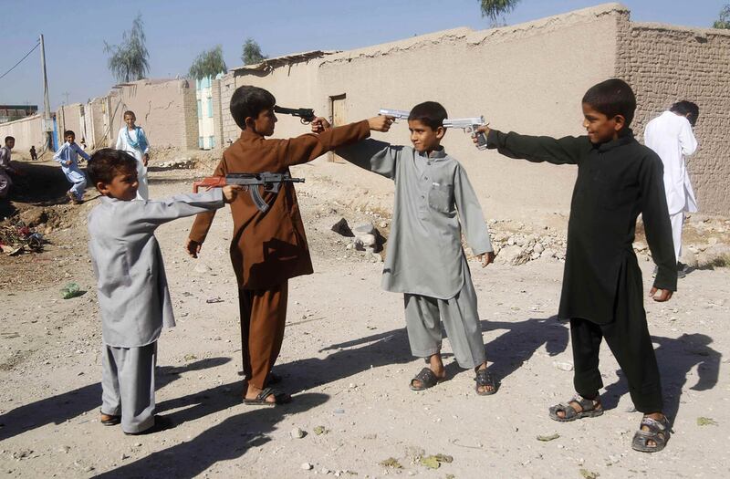 Afghan boys play with toy guns on the first day of Eid Al Adha in Jalalabad. Parwiz / Reuters



