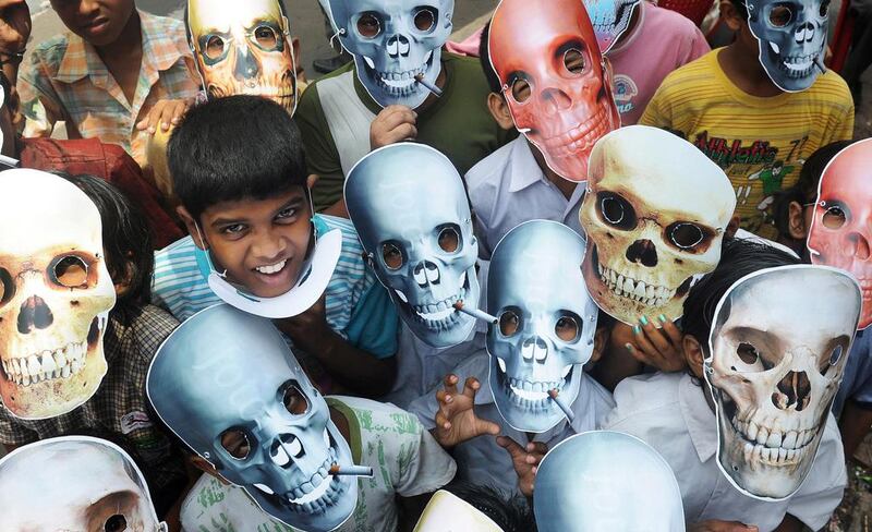 Young schoolchildren wear anti-smoking masks during a ‘No Tobacco’ rally in Kolkata in 2012. World No Tobacco Day is observed around the world every year on May 31 and is one of the important World Health Awareness days organized by the World Health Organisation (WHO). Dibyangshu Sarkar / AFP photo