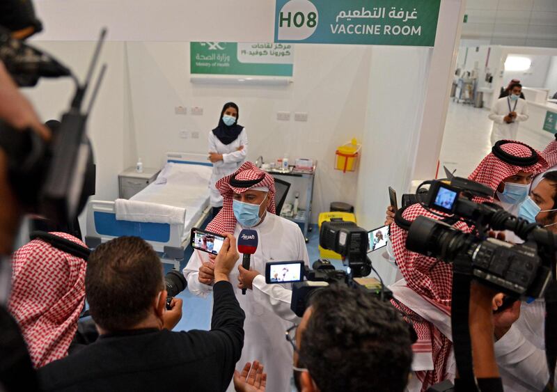 The first Saudi citizen to receive the Pfizer-BioNTech Covid-19 vaccine speaks to reporters after its administration at a vaccination centre supervised by the health ministry in the capital Riyadh. AFP