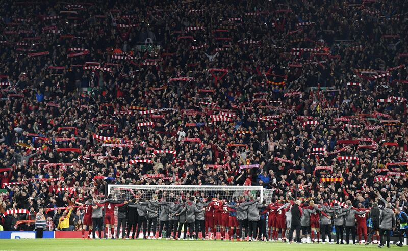 Liverpool players celebrate in front of their fans after the UEFA Champions League semi final.  EPA